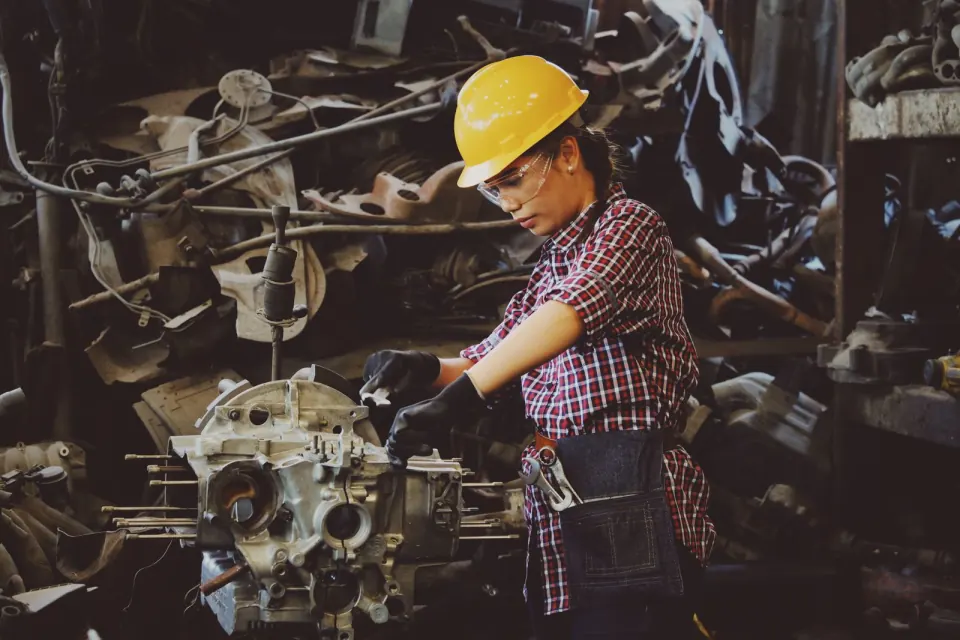 Installer working on an injection moulding machine